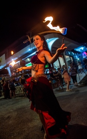 bellydancer fire dancing with palm torches