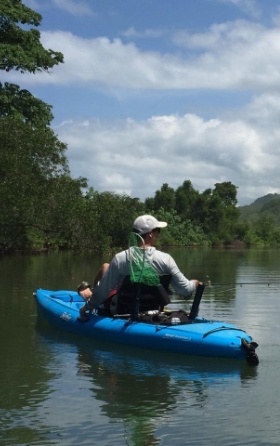 man fishing in kayak