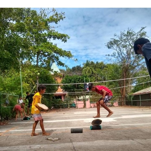 boys playing with balance board