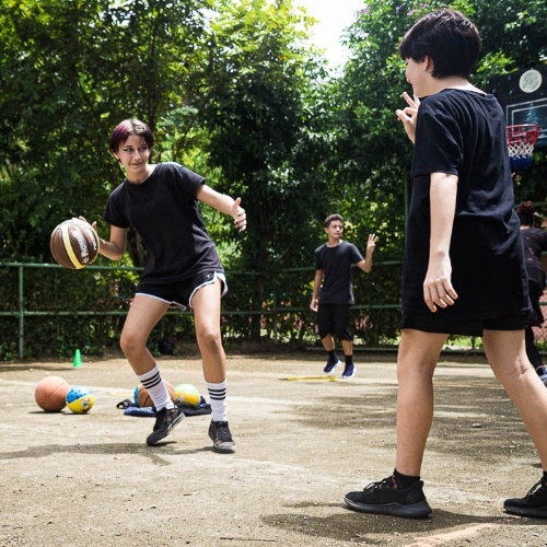 two girls playing basketball