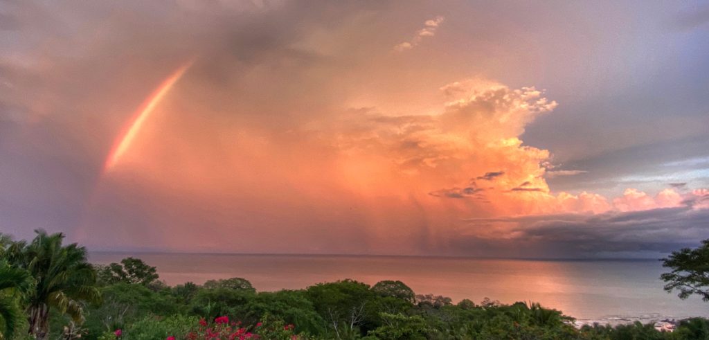 Orange and purple Sky with Rainbow over Cedros beach