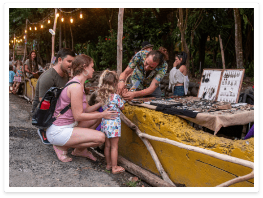 artezano helping girl put on a bracelet