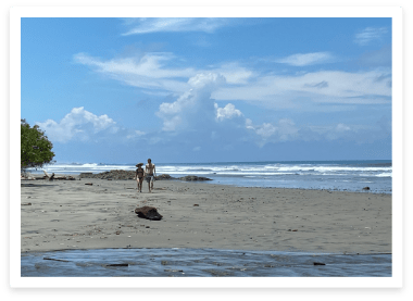 couple walking on Playa Grande